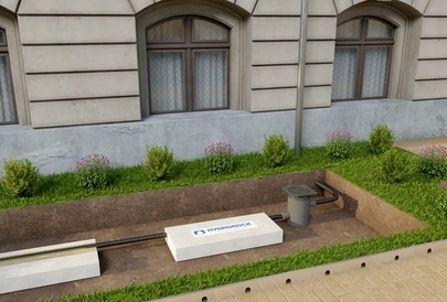 A 3D cutaway showing a stormwater unit installed under planting beside a building